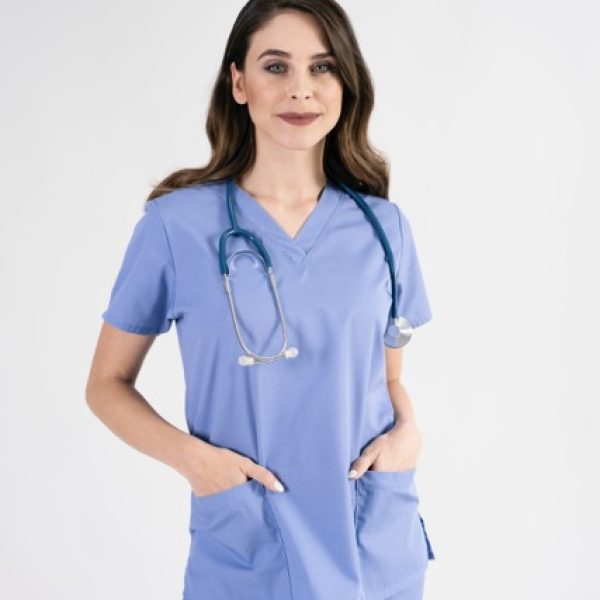 Portrait of smiling nurse with stethoscope in studio shot